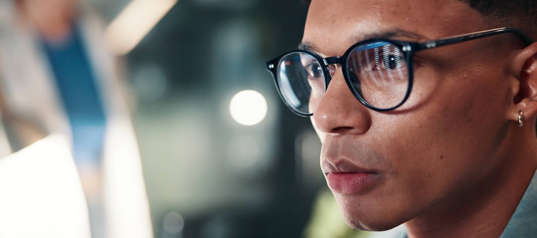 Young black man staring at a computer screen