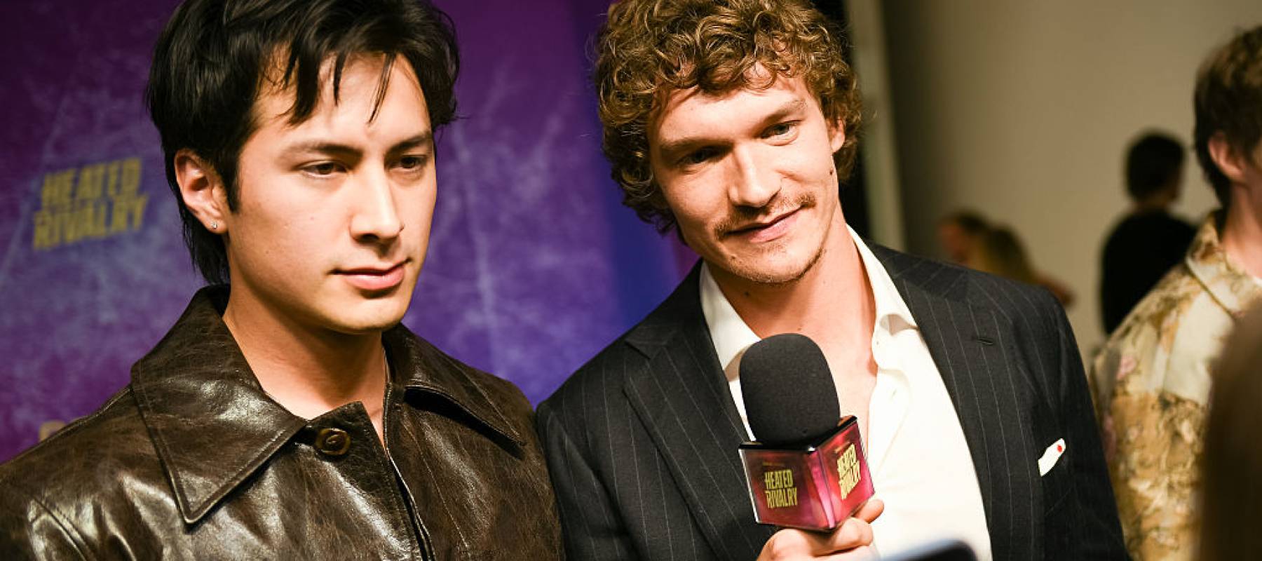 Hudson Williams and Connor Storrie attend the premiere of "Heated Rivalry" at TIFF Lightbox on November 24, 2025 in Toronto, Ontario