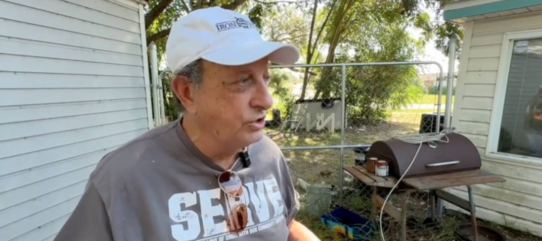 Florida landlord Tom Luby speaking to reporters outside his rental home.