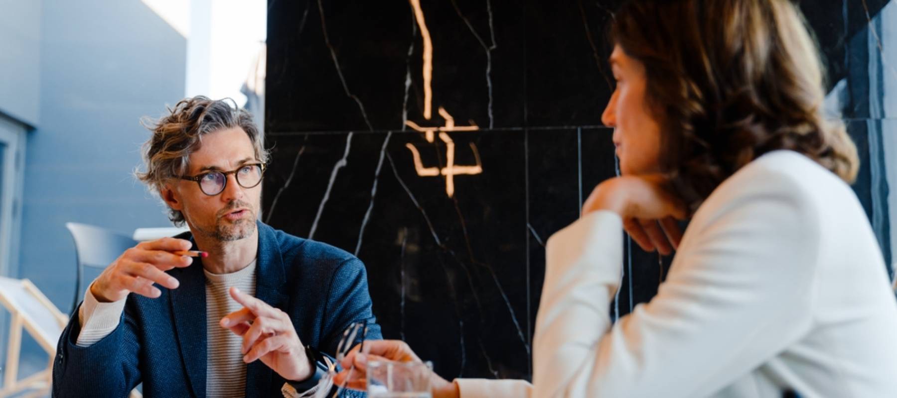 Two people discussing financial confidence