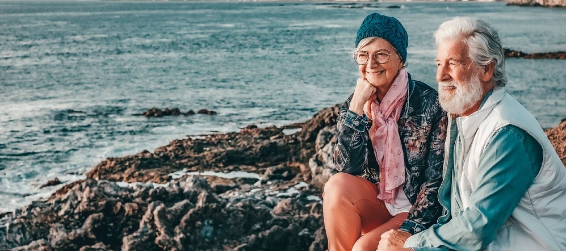 Retired couple on beach