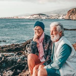 Retired couple on beach