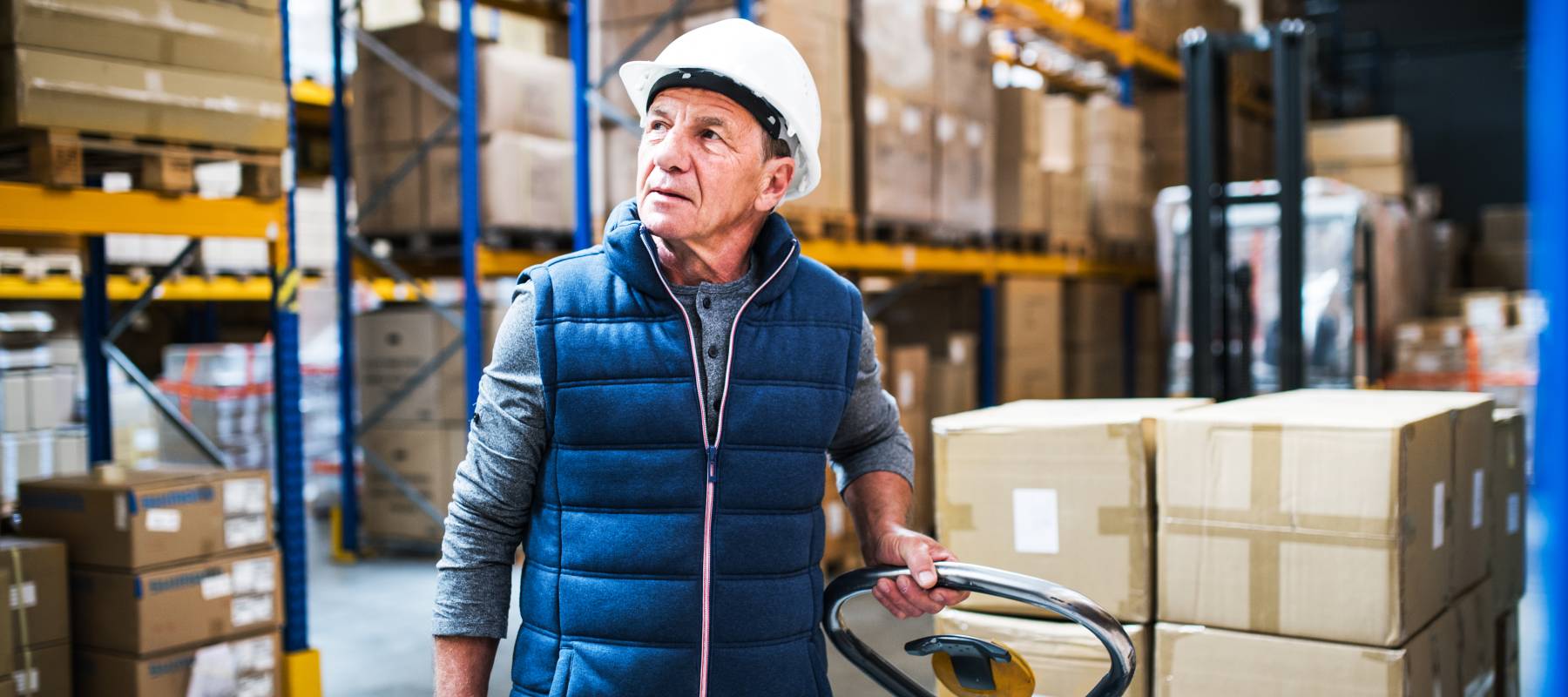 Older man working in a warehouse