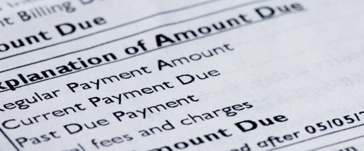 Close-up of credit card statement with focus on Total Amount Due