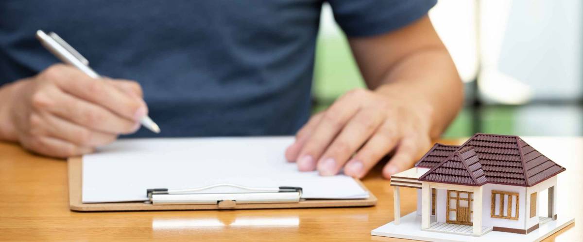 Homeowners selected refinancing of house and checking interest rates and monthly payments. Home mortgage loans from bank concept