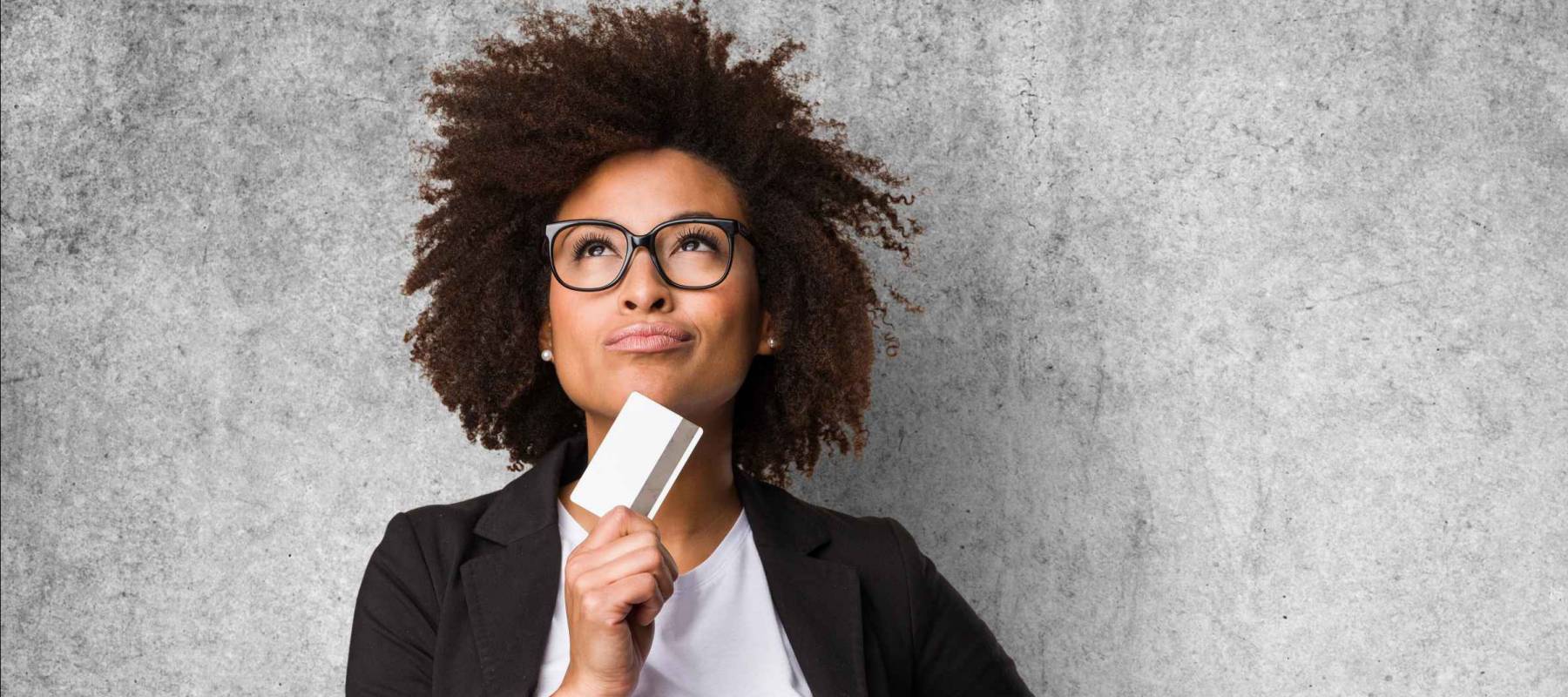 business black woman holding a credit card