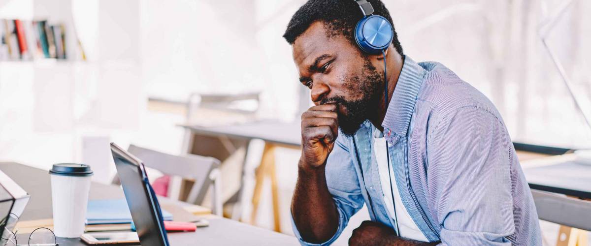 Young african american hipster guy in headphones