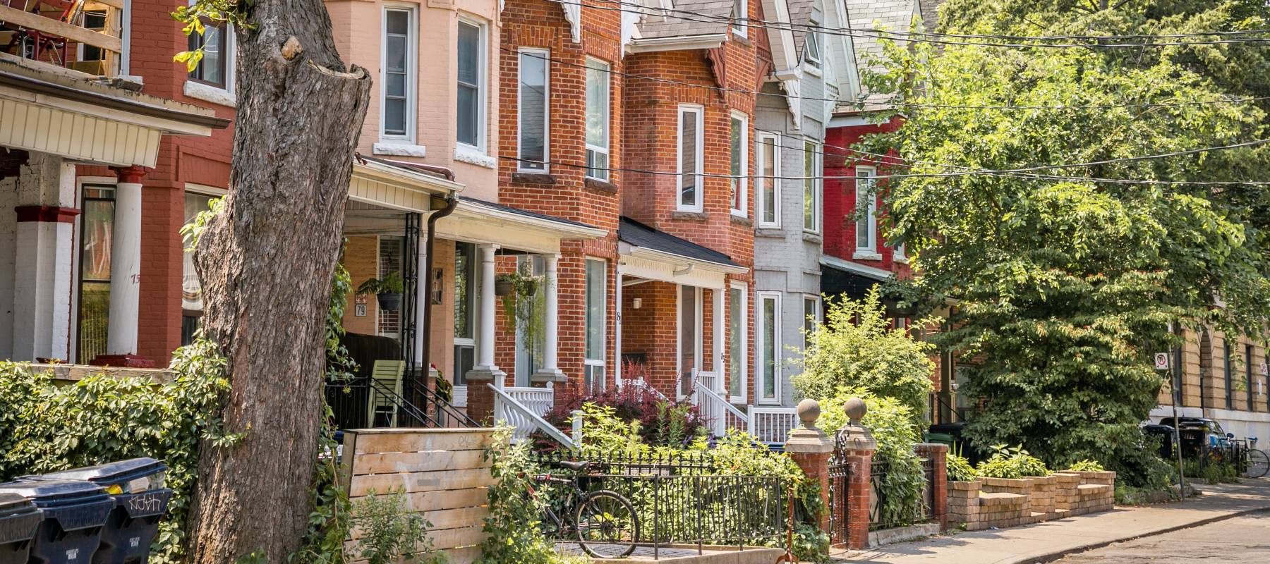 Vintage Brick Houses in a line on the sidewalk in Kensington Market