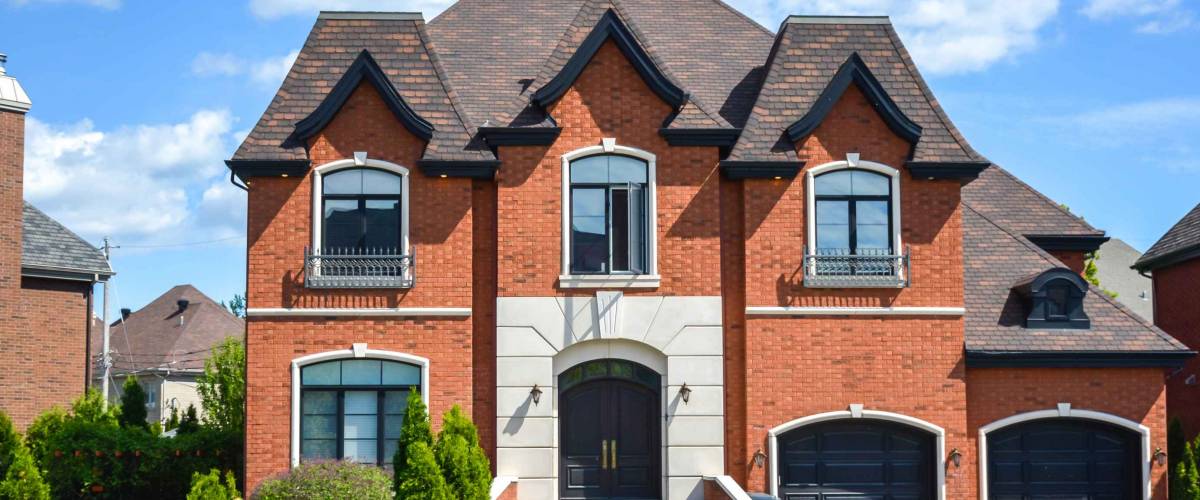 Luxury house in Montreal, Canada against blue sky