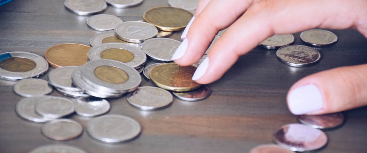Counting loose change Canadian coins money