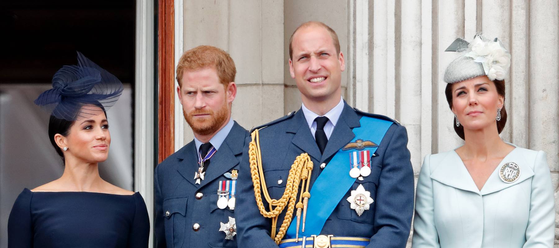Prince Harry and Megan stand beside Prince William and Kate during a Buckingham Palace event, July 2018