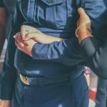 People holding hands at a funeral