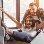 young Caucasian couple with moving boxes