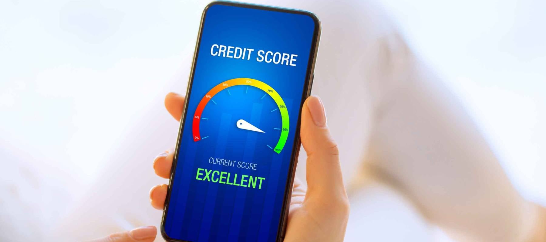 Woman looking at her credit score test on mobile phone showing excellent score