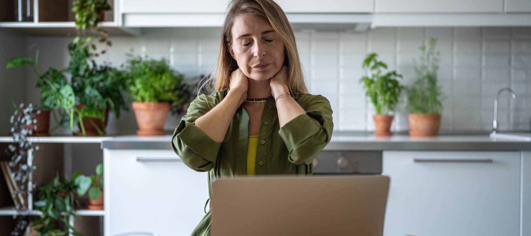 woman stressed sitting in front of laptop