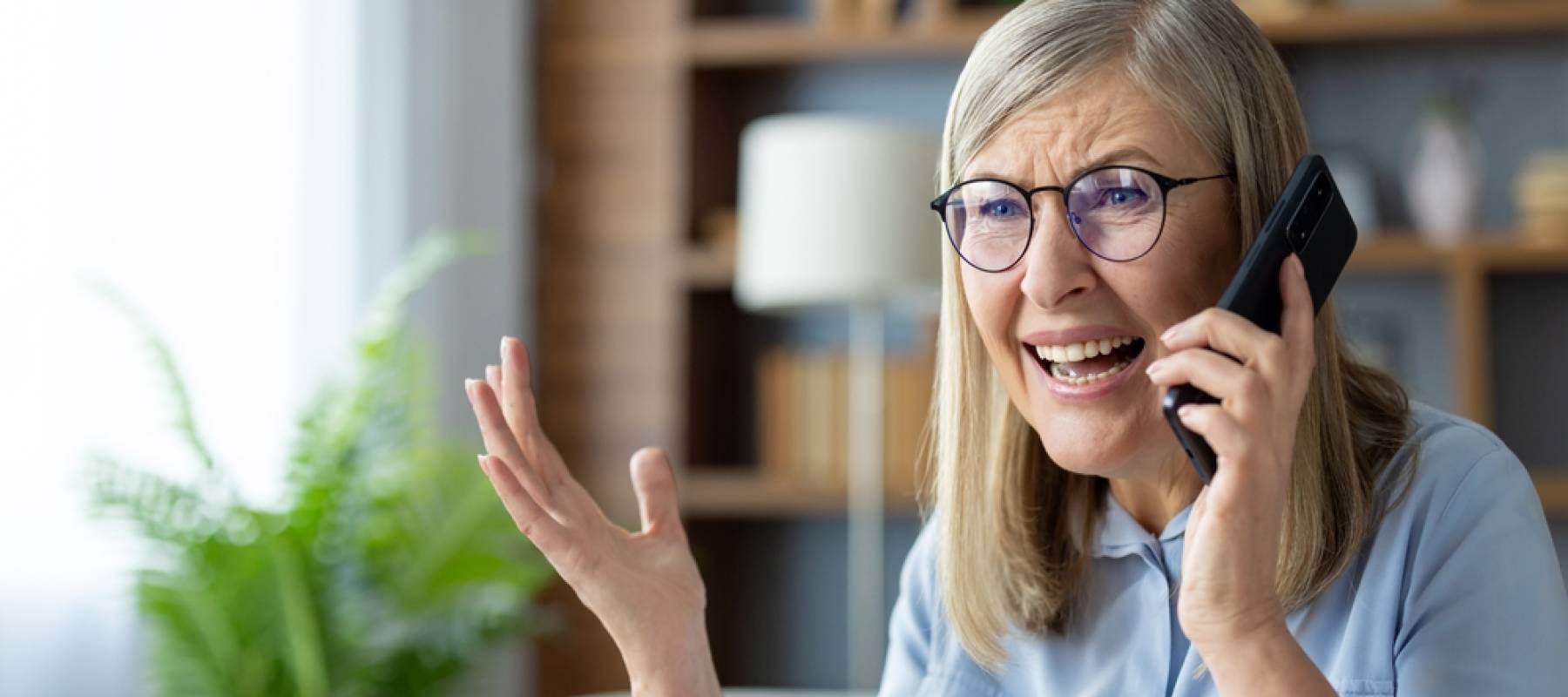 Older woman upset and talking to customer service on the phone
