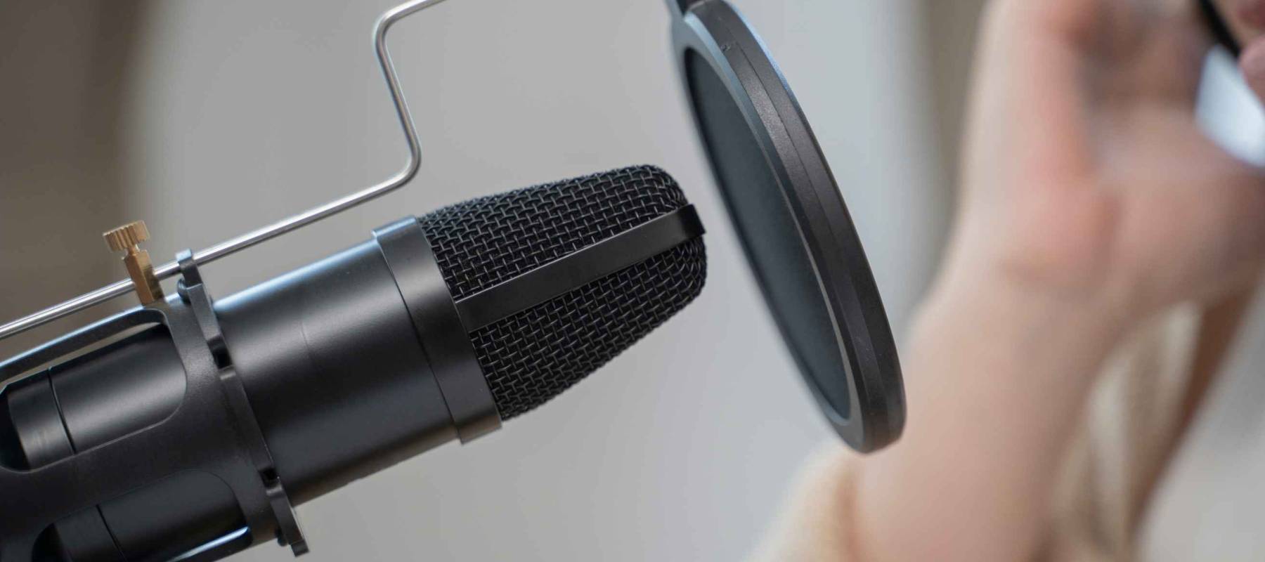 Using condenser mic for making podcast, Close up.