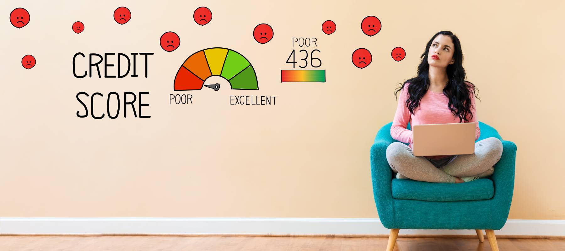 Young woman sitting on a chair on her laptop. The words credit score is projected on the wall behind her.