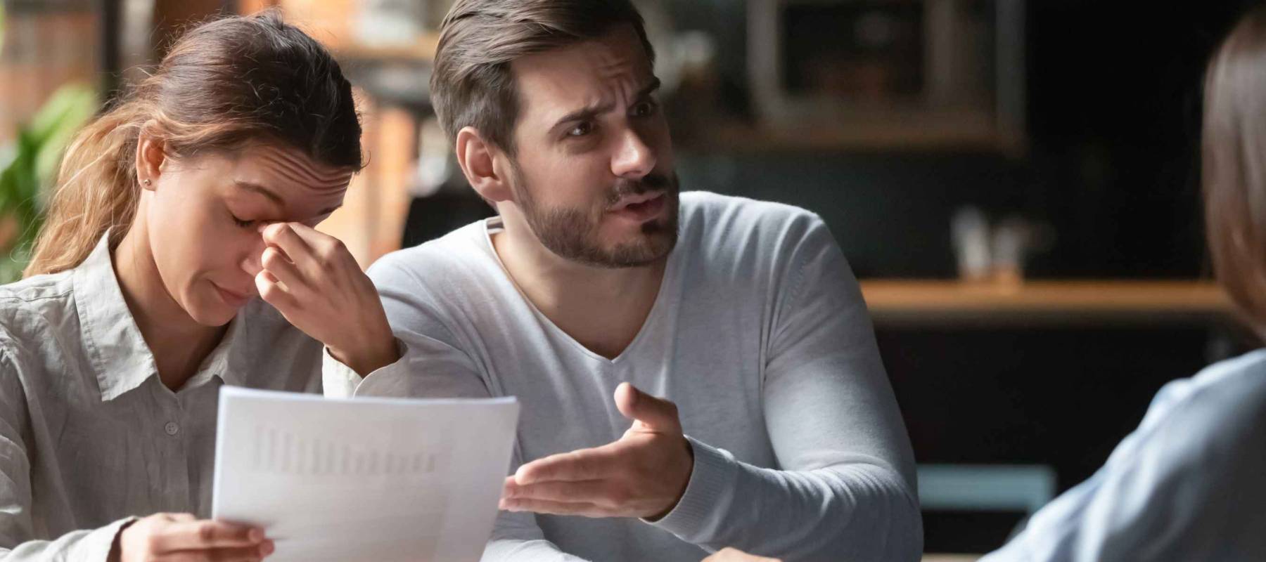 Angry young couple complaining, bad contract terms with financial advisor