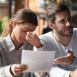 Angry young couple complaining, bad contract terms with financial advisor