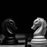 two knights on a chessboard facing off against each other