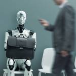 AI robot sitting waiting in a room as humans walk past