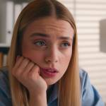 Tired and worried younger woman