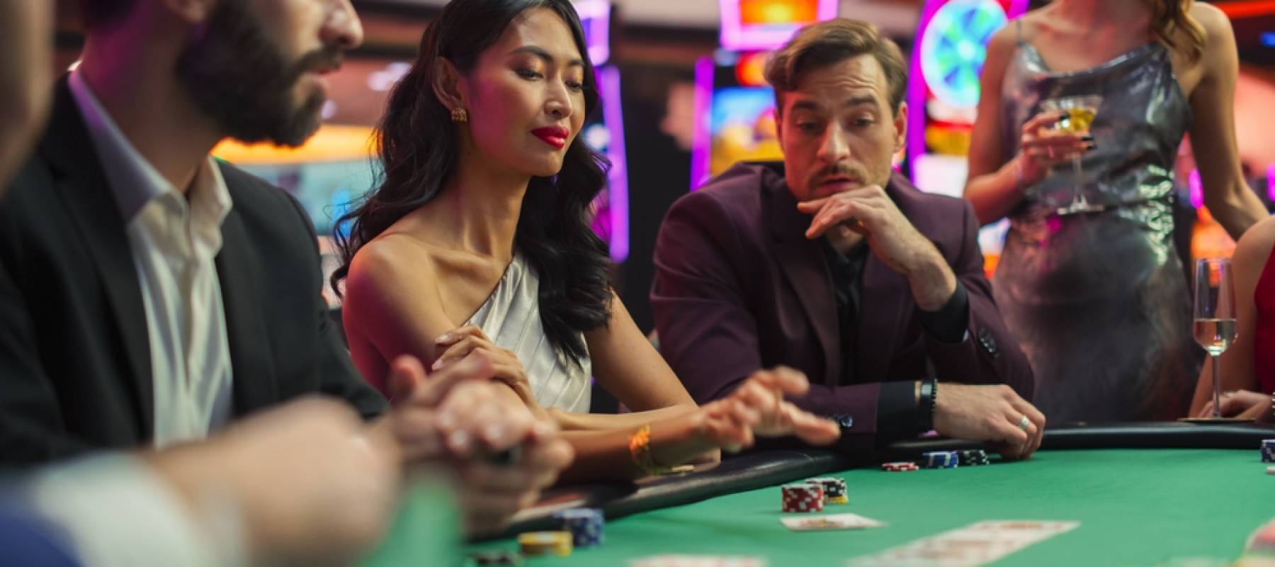 Group of people playing poker at a casino