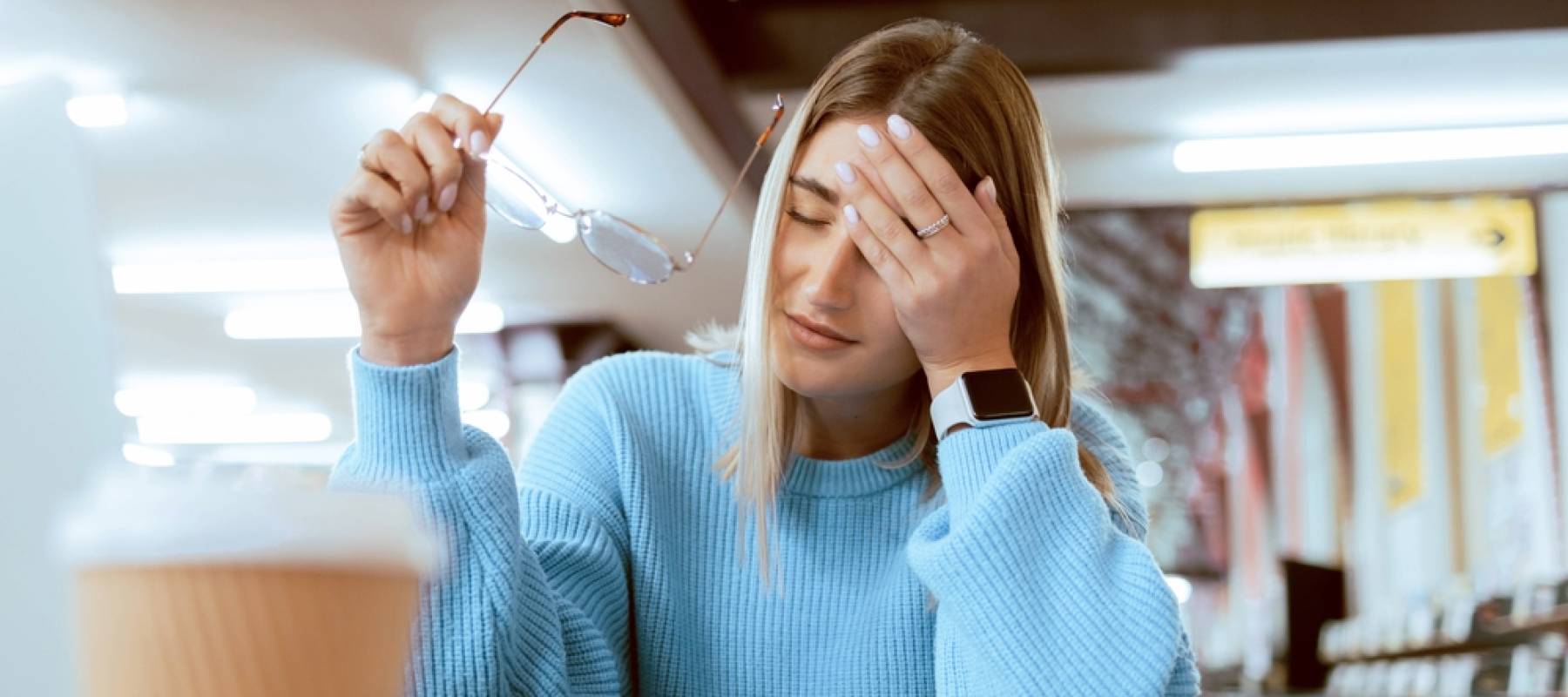 Young woman looking stressed while working