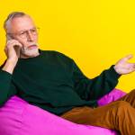 Photo portrait of retired man on the phone
