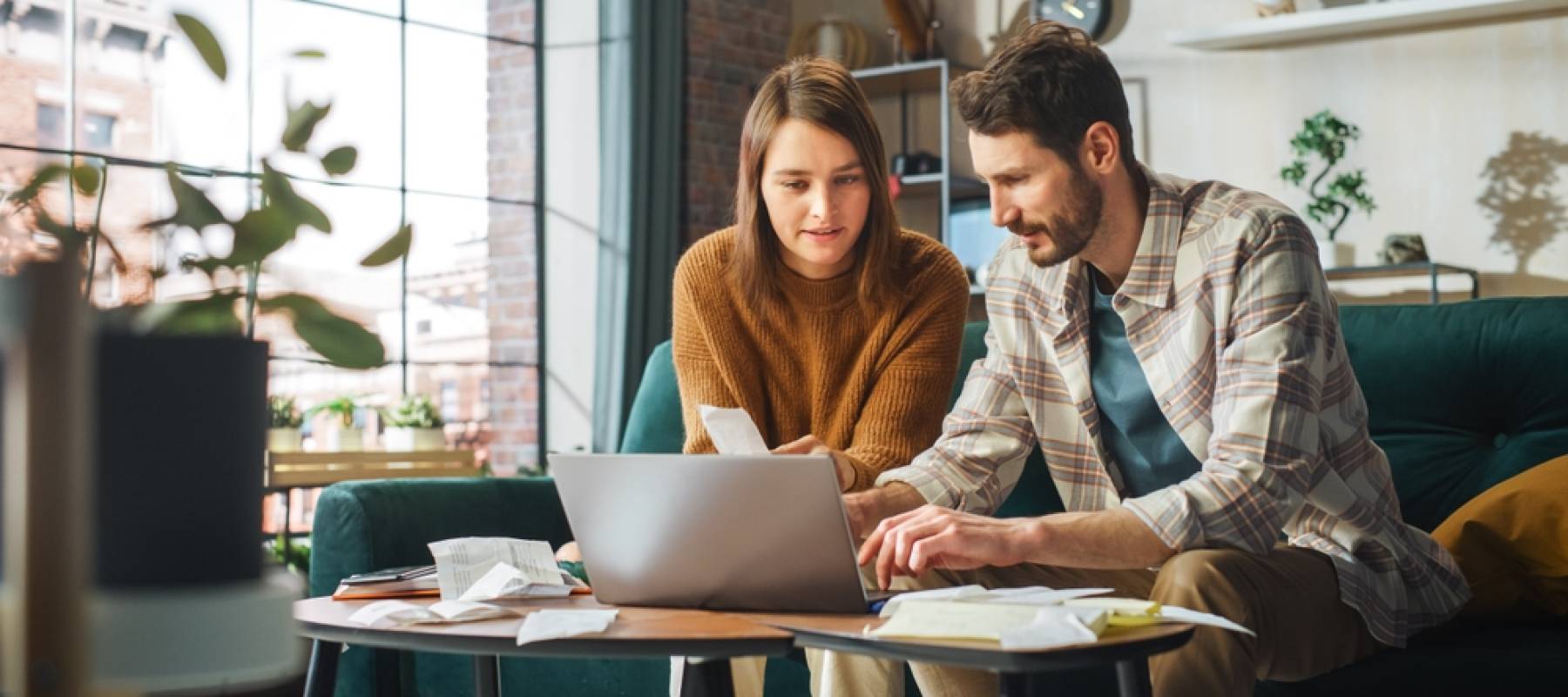 Stressful Accounting at Home: Couple Using Laptop Computer