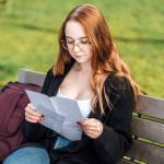 Young woman considering paperwork