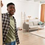 A young men welcomes you into his home.