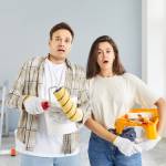 Young concerned-looking couple