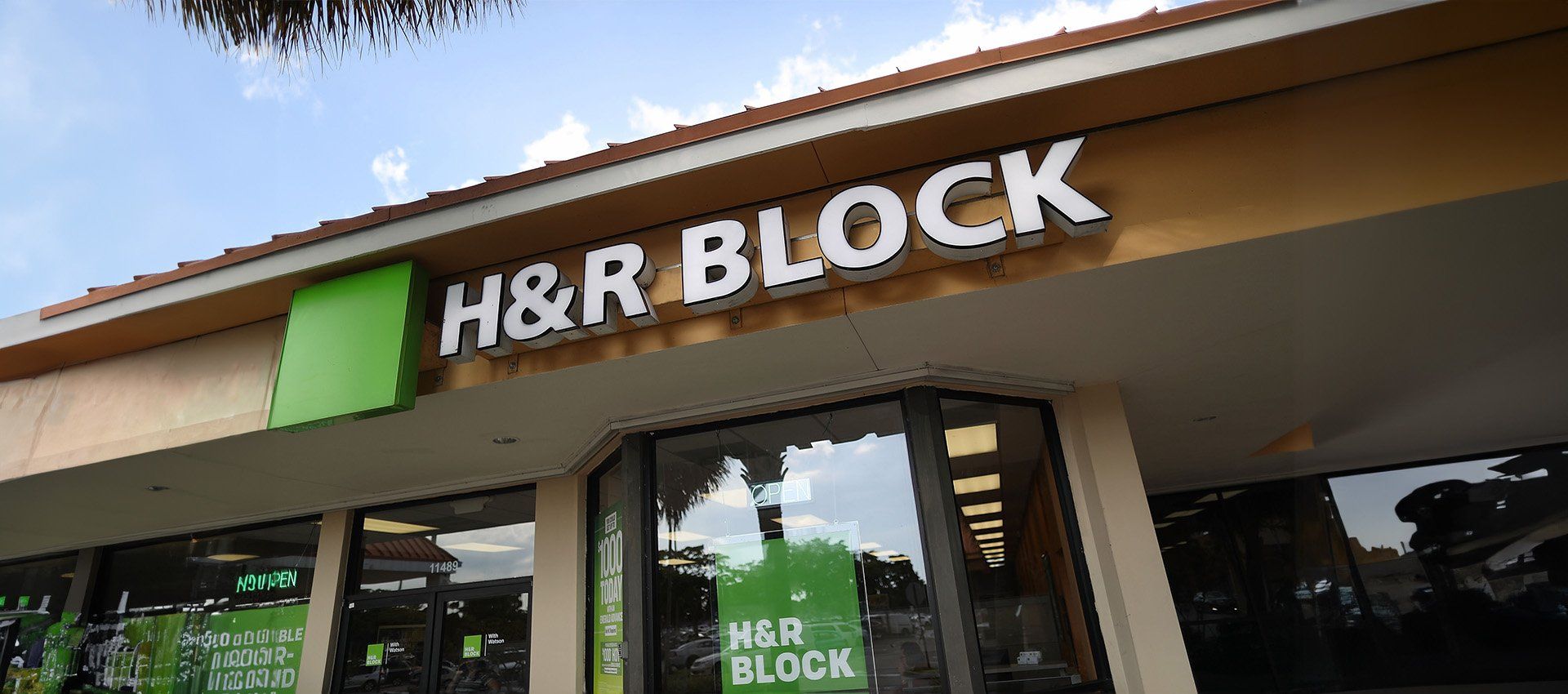 h and r block office building with signage, exterior