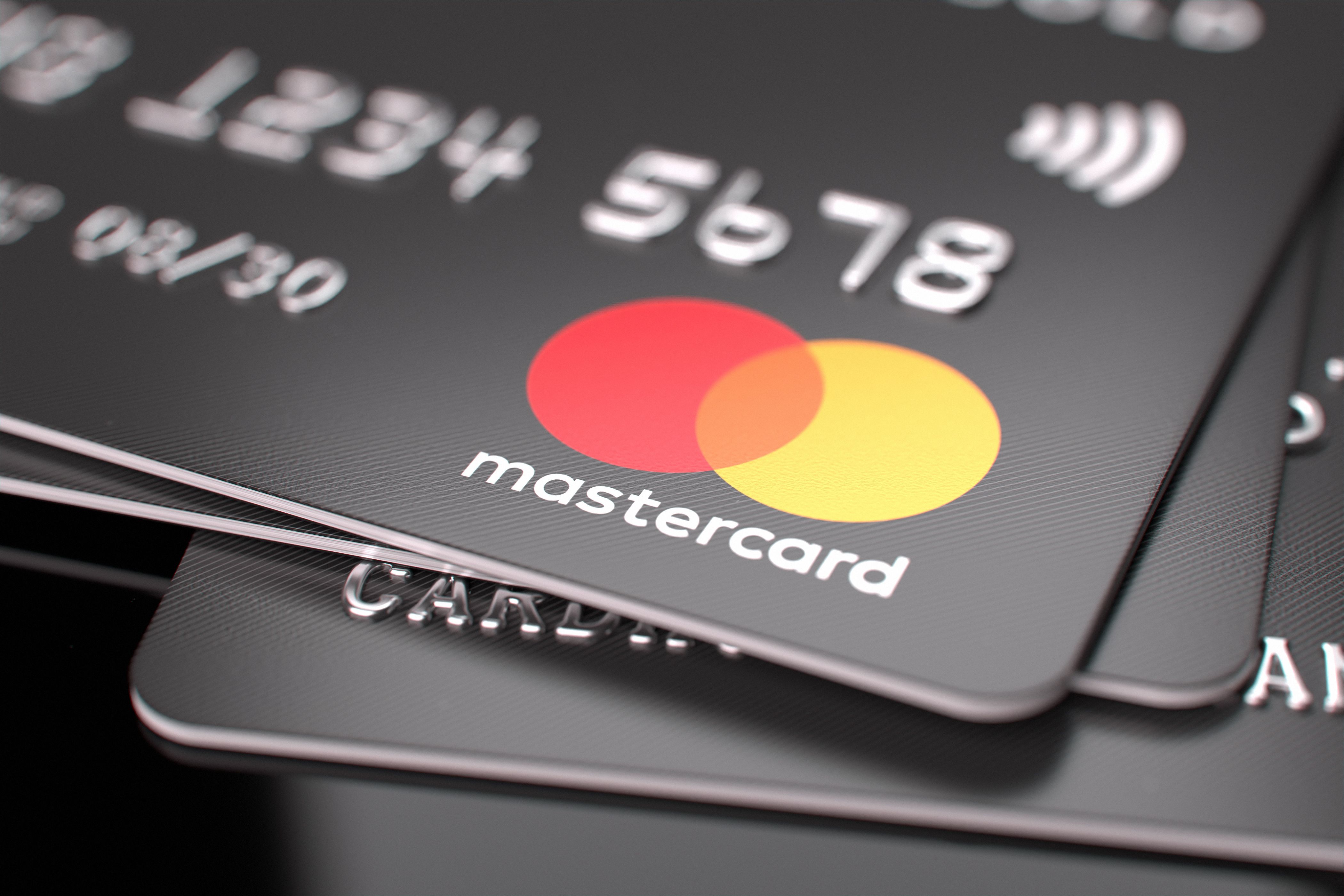 Mastercard bank cards on the table. Close-up of the Mastercard logo. E-commerce concept. Selected focus. 