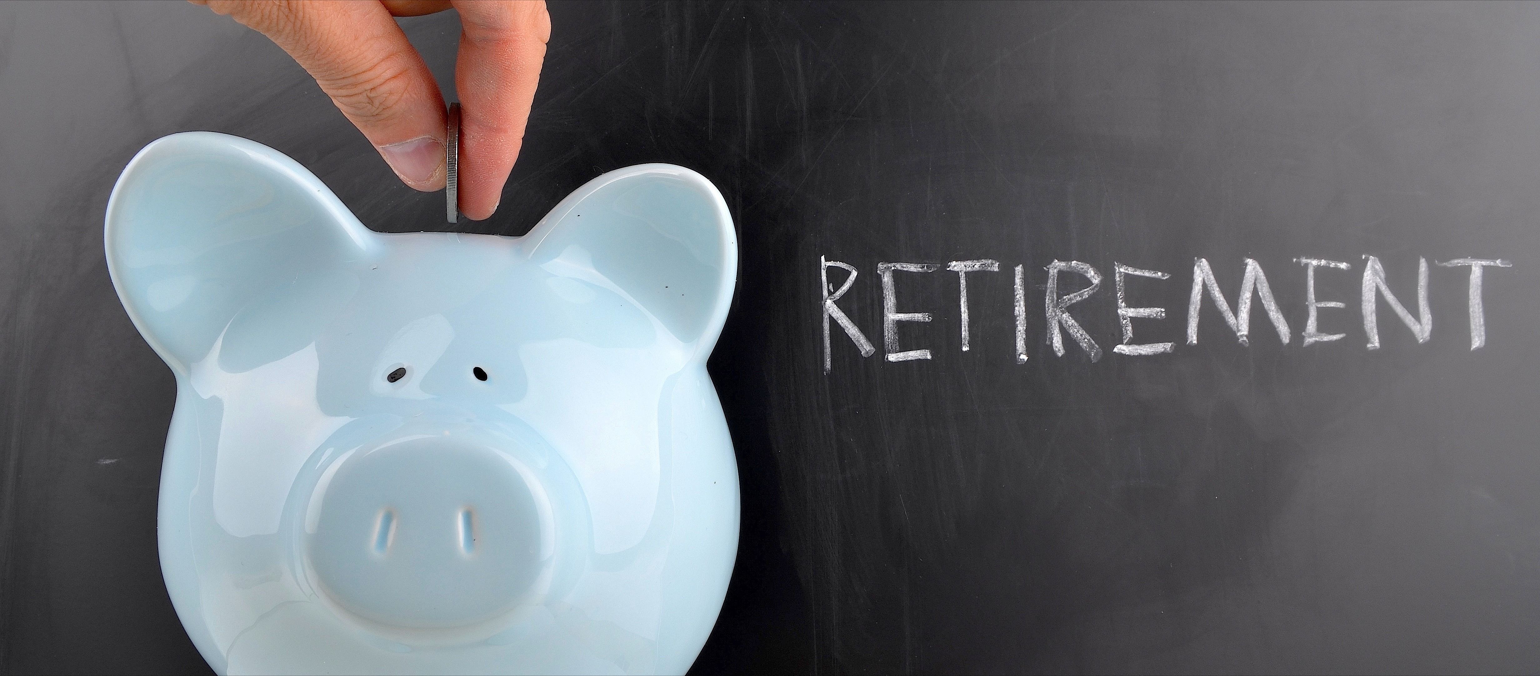 Saving for retirement in a blue piggy bank