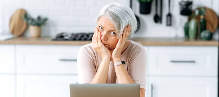Mature retired woman looking confused
