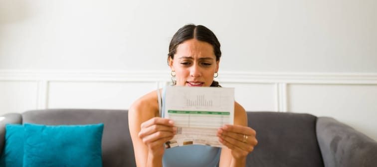 Woman worried about credit card bills.