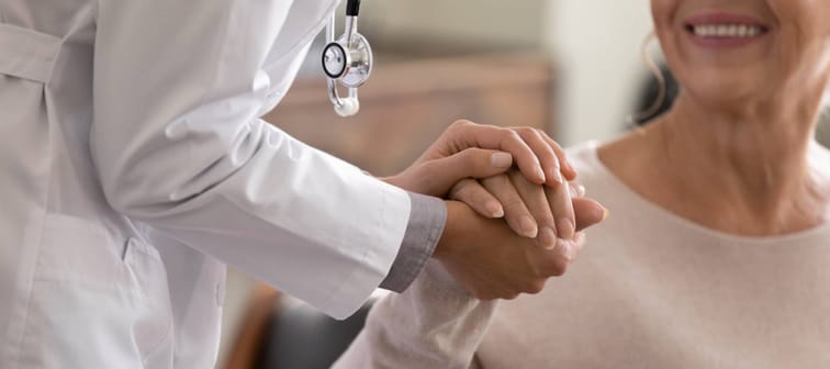 Doctor helping woman