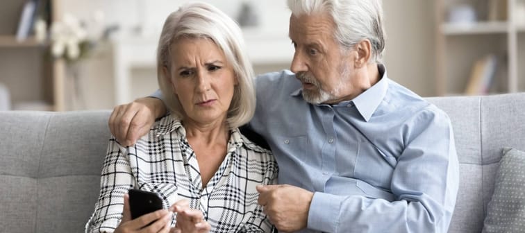Older couple looking stressed