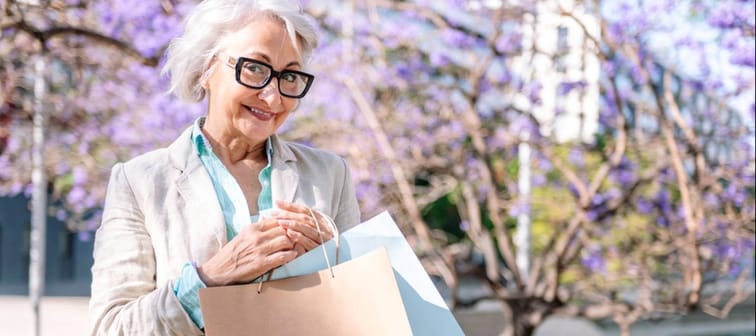 Senior woman holding shopping bags