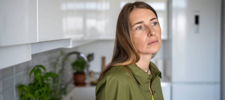 Pensive looking middle-aged woman