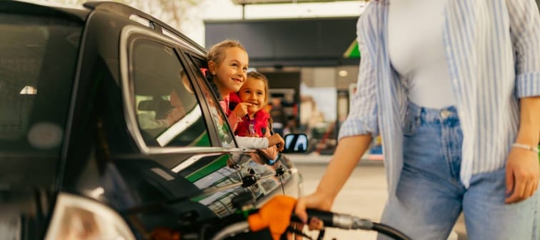 Mom filling car with gas