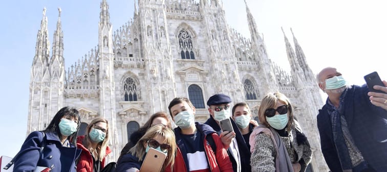 Tourists and Milanese people walk in the center with the mask to avoid a possible infection in Lombardy