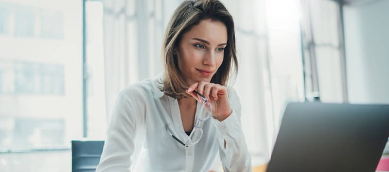 Woman looking at laptop screen