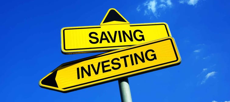 Signs pointing in different directions. Savings vs investing.