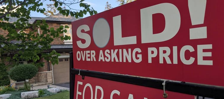 Sold over asking price sign in front of detached house. Is there potential for a real estate correction?