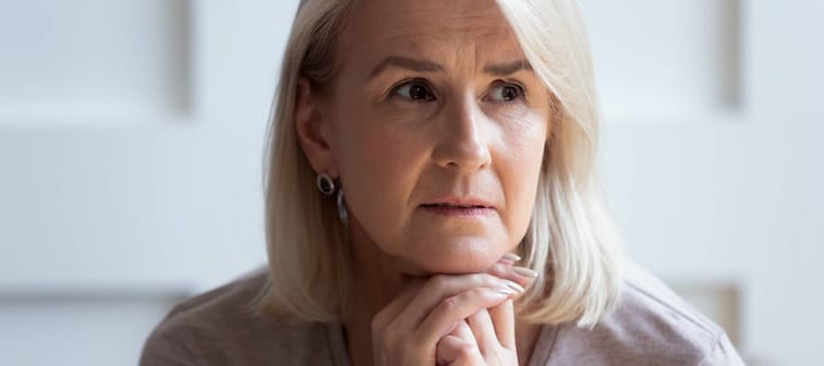 Headshot of unhappy older woman