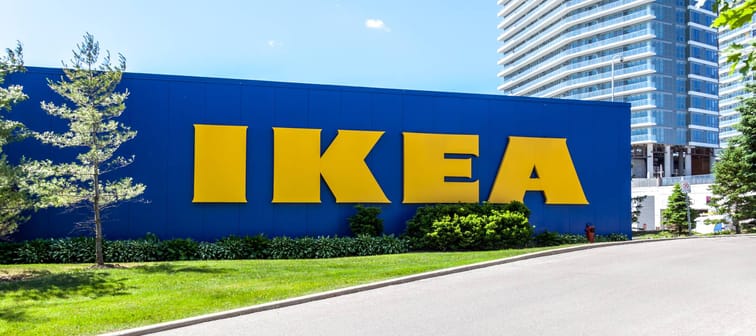 Sign of Ikea with building in background at North York in Toronto